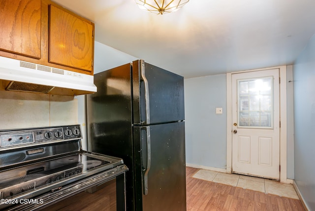 kitchen featuring light hardwood / wood-style flooring and black appliances