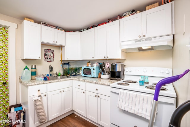 kitchen featuring white cabinetry, light stone countertops, white appliances, and sink