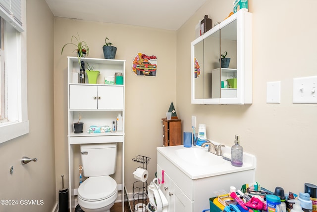 bathroom featuring vanity and toilet