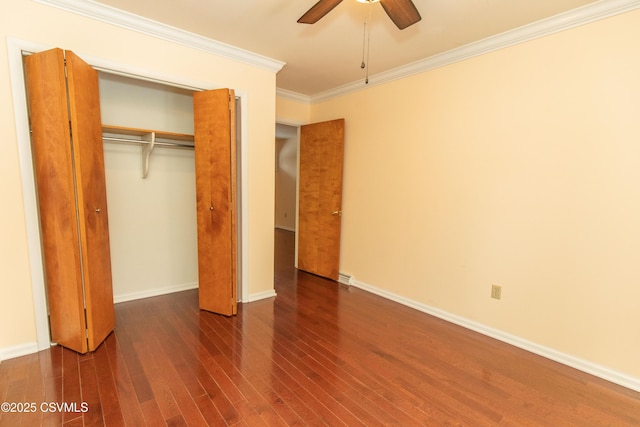 unfurnished bedroom featuring ceiling fan, dark hardwood / wood-style floors, a closet, and ornamental molding