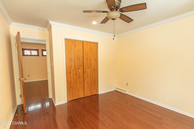 unfurnished bedroom with ceiling fan, a closet, dark hardwood / wood-style flooring, and crown molding