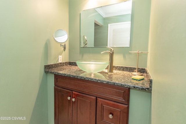 bathroom with vanity and crown molding