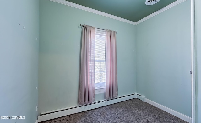 spare room with ornamental molding, carpet floors, and a baseboard heating unit