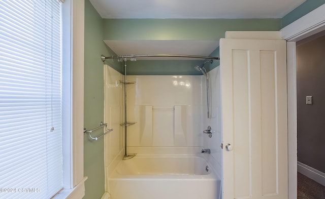 bathroom with shower / bathing tub combination and a wealth of natural light