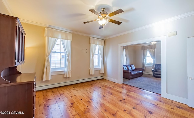 interior space with crown molding, ceiling fan, light hardwood / wood-style floors, and a baseboard heating unit