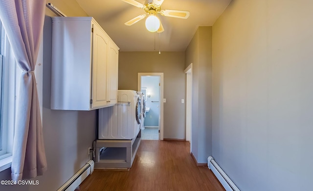 corridor with hardwood / wood-style floors and a baseboard radiator