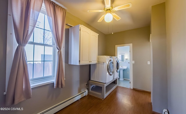 clothes washing area featuring ceiling fan, wood-type flooring, a baseboard heating unit, and independent washer and dryer