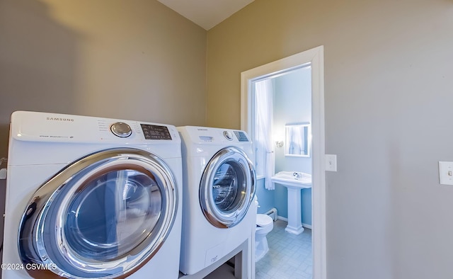 laundry room featuring sink and independent washer and dryer