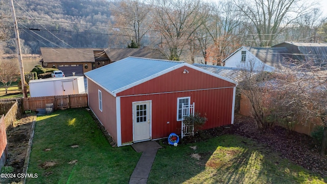 view of outdoor structure featuring a yard