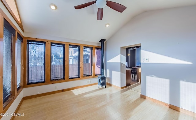 spare room featuring ceiling fan, light hardwood / wood-style flooring, and vaulted ceiling