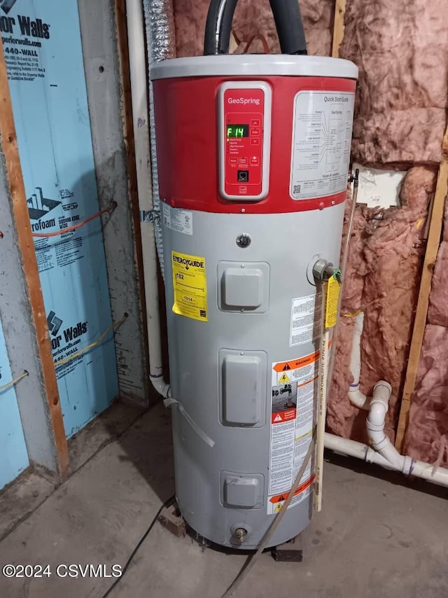 utility room featuring water heater