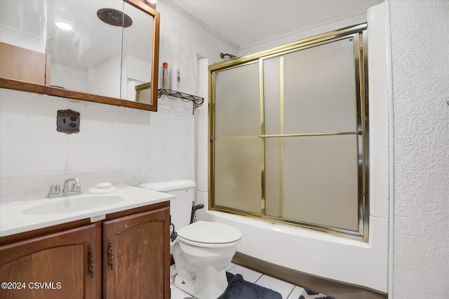 full bathroom featuring tile patterned flooring, vanity, toilet, and shower / bath combination with glass door