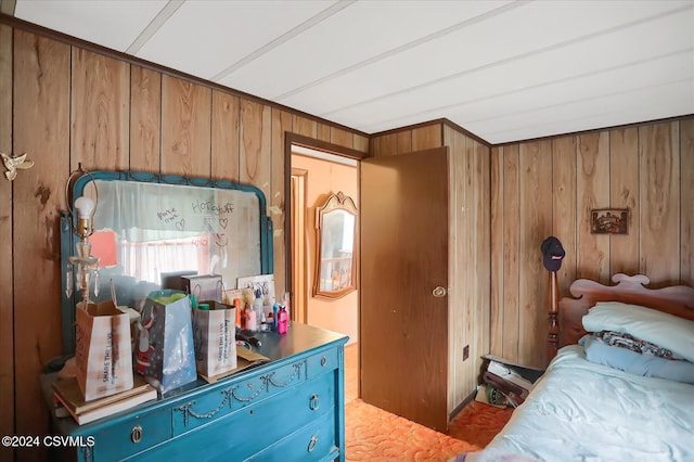 bedroom with wood walls