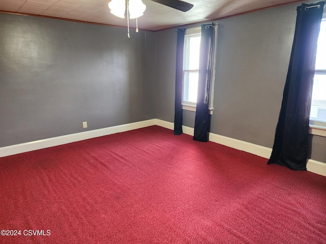 unfurnished room with carpet flooring, ceiling fan, and ornamental molding