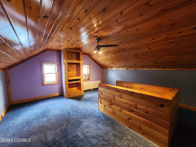 bonus room with dark carpet, vaulted ceiling, ceiling fan, wooden ceiling, and radiator heating unit