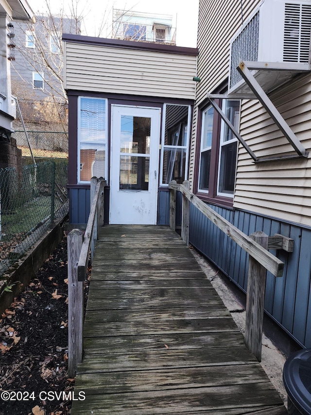 doorway to property with a wooden deck