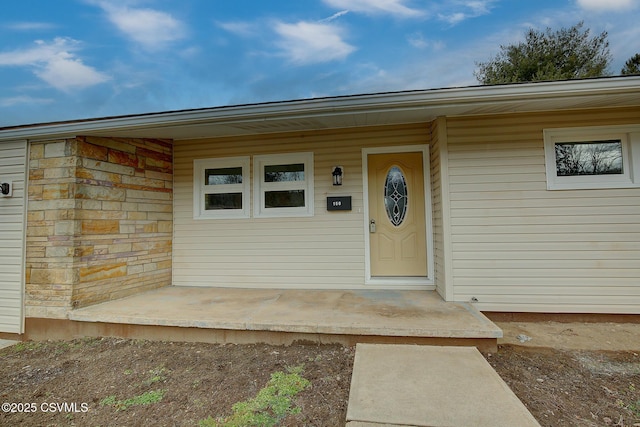 doorway to property with a porch