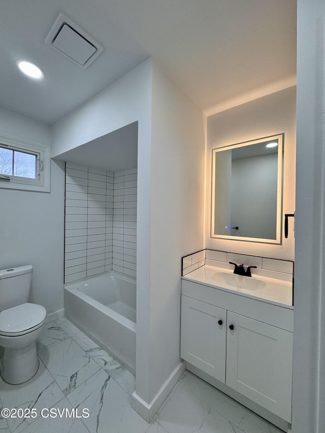 bathroom with a bathing tub, vanity, and toilet