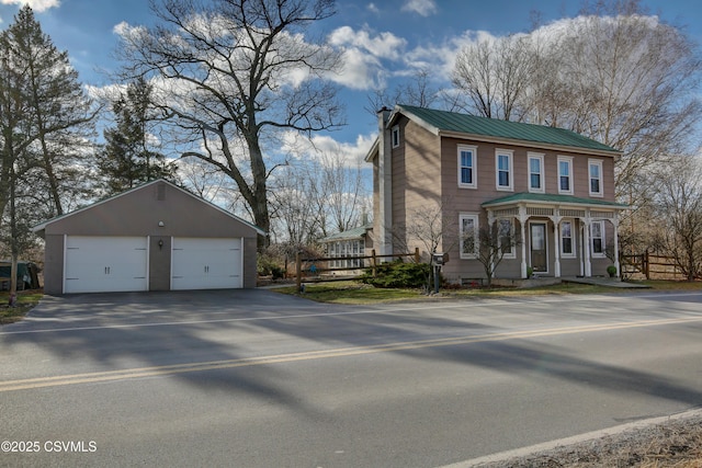 view of front facade with a garage and an outdoor structure