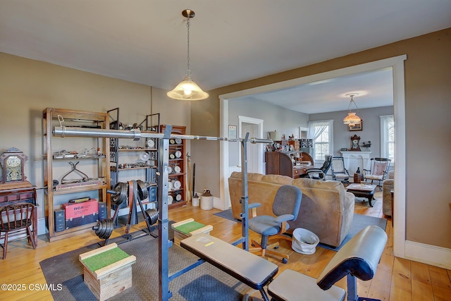 exercise area with light hardwood / wood-style floors