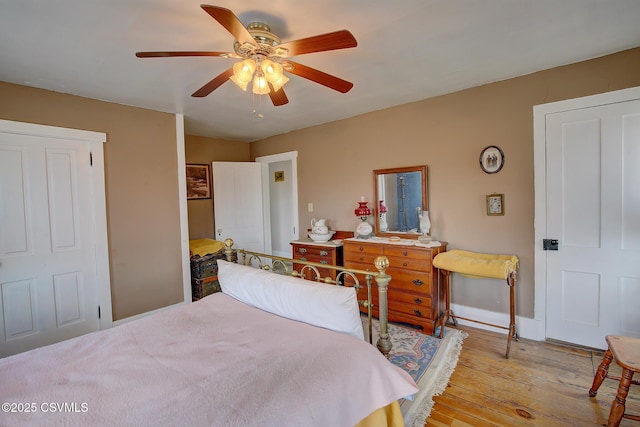 bedroom featuring ceiling fan and light hardwood / wood-style flooring