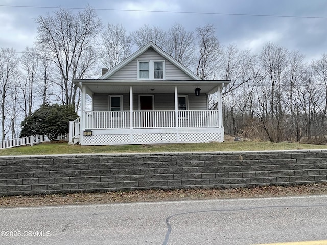 bungalow-style house featuring covered porch