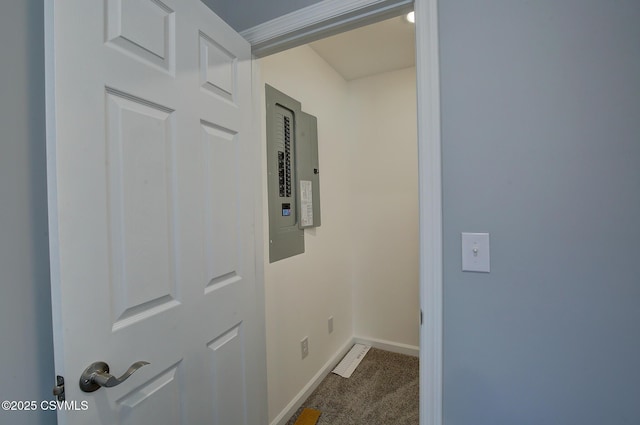 hall with carpet flooring and electric panel