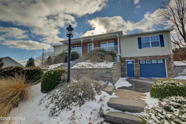 view of front facade with a porch and a garage