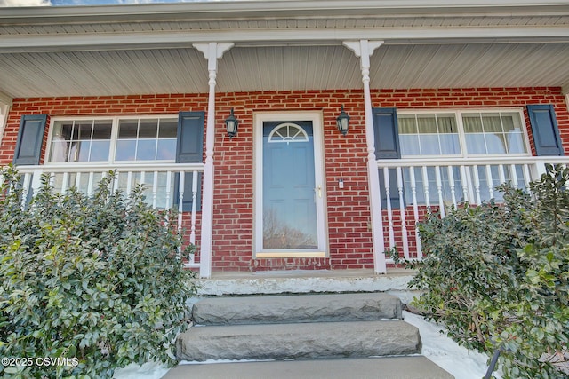 property entrance featuring a porch