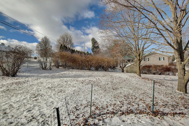 view of yard covered in snow