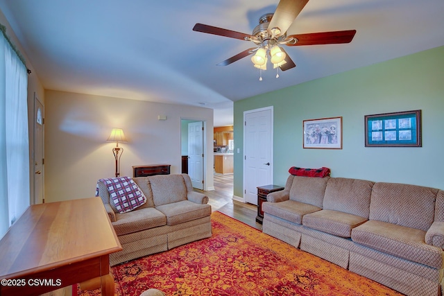 living room with hardwood / wood-style flooring and ceiling fan