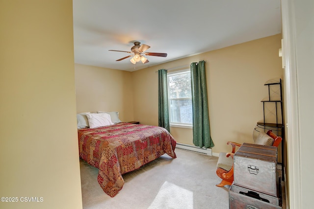 carpeted bedroom with baseboard heating and ceiling fan