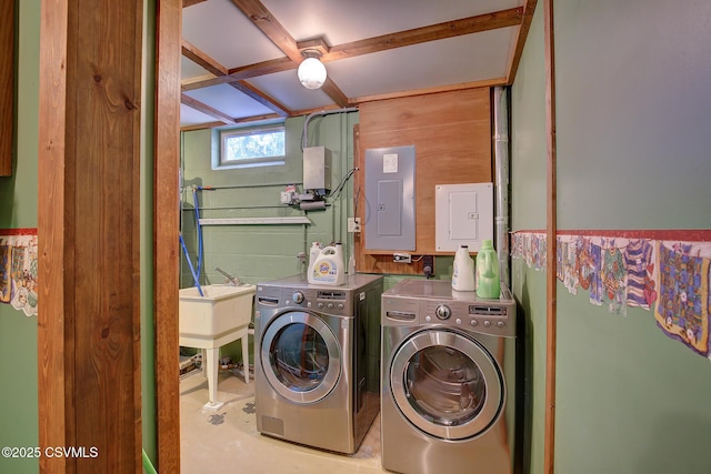 washroom featuring electric panel and independent washer and dryer