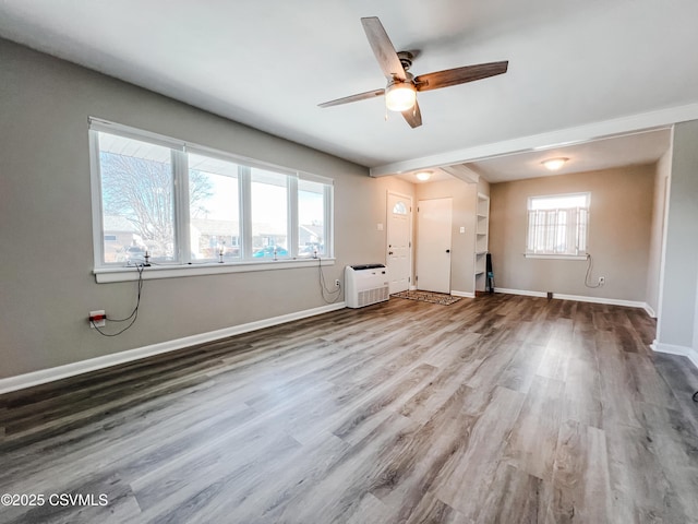 unfurnished room featuring hardwood / wood-style floors and ceiling fan