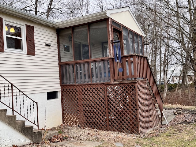 view of side of home with a sunroom