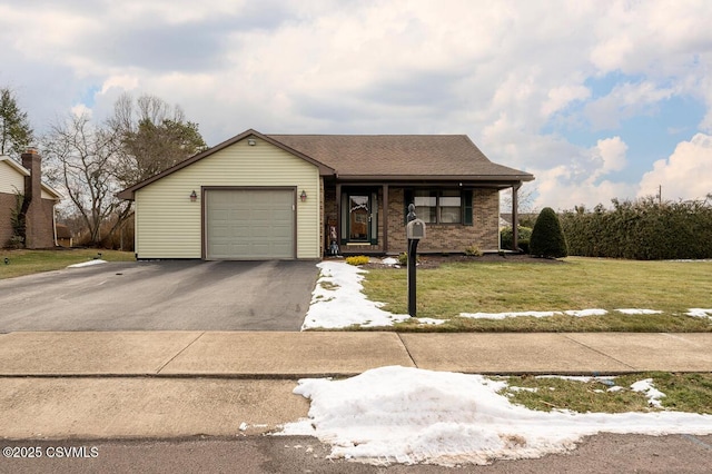 view of front of house with a front lawn and a garage