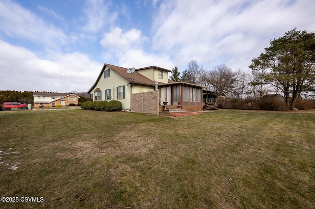 view of side of home with a lawn