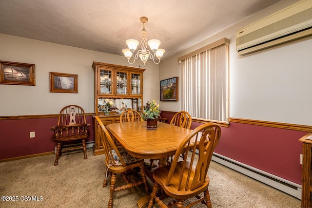 carpeted dining room featuring an AC wall unit, a chandelier, and a baseboard radiator