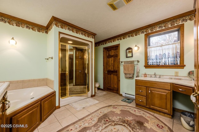 full bathroom featuring toilet, vanity, a baseboard heating unit, tile patterned floors, and a textured ceiling