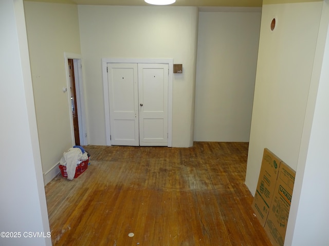 hallway with dark hardwood / wood-style floors