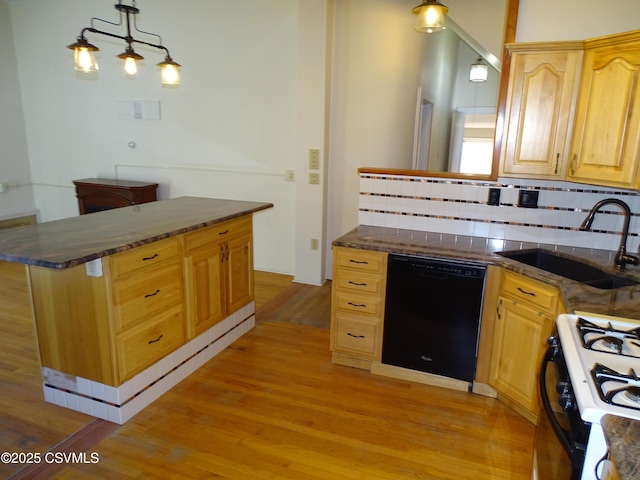 kitchen with dishwasher, sink, tasteful backsplash, decorative light fixtures, and range with gas cooktop