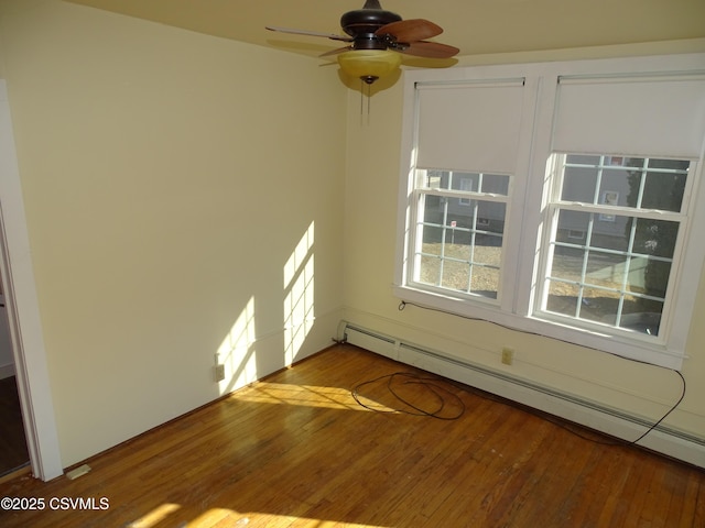 empty room featuring ceiling fan, a baseboard radiator, and light wood-type flooring