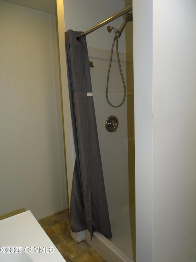 bathroom featuring walk in shower