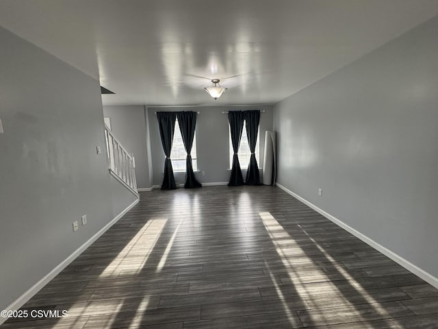 empty room with dark hardwood / wood-style floors