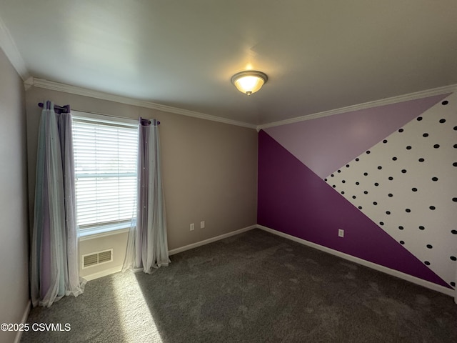 spare room with dark colored carpet and crown molding