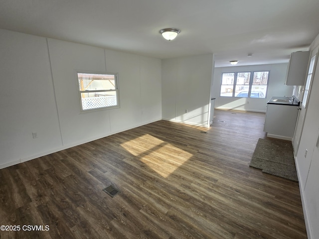 empty room with dark hardwood / wood-style floors