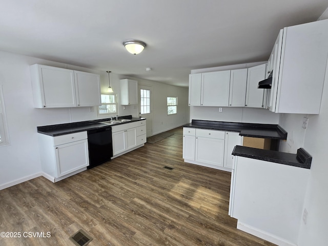 kitchen featuring black dishwasher, pendant lighting, and white cabinets