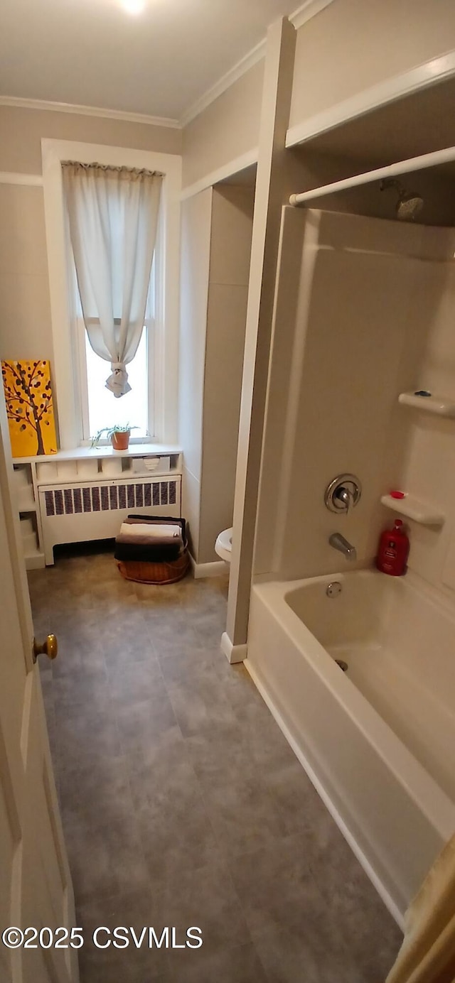 bathroom featuring shower / washtub combination, toilet, radiator, and ornamental molding