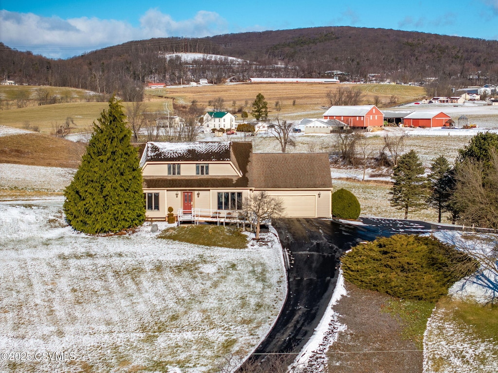 snowy aerial view with a mountain view