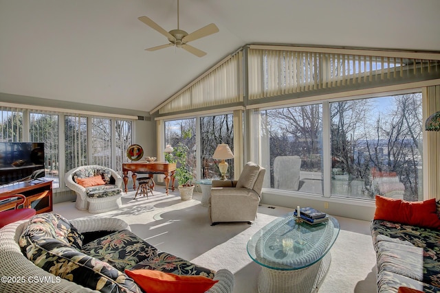 sunroom / solarium featuring a healthy amount of sunlight, a ceiling fan, and lofted ceiling